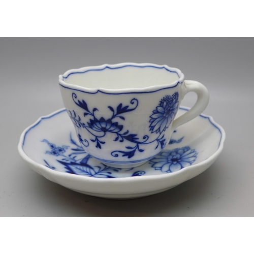 615 - A Meissen small blue and white Blue Onion pattern cup and saucer with crossed swords mark to base