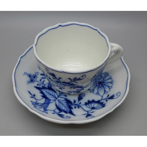 615 - A Meissen small blue and white Blue Onion pattern cup and saucer with crossed swords mark to base