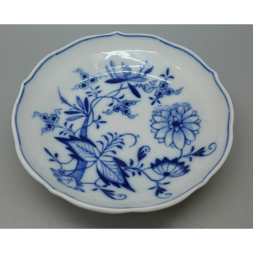 615 - A Meissen small blue and white Blue Onion pattern cup and saucer with crossed swords mark to base