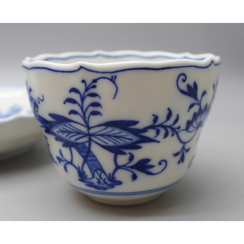 615 - A Meissen small blue and white Blue Onion pattern cup and saucer with crossed swords mark to base