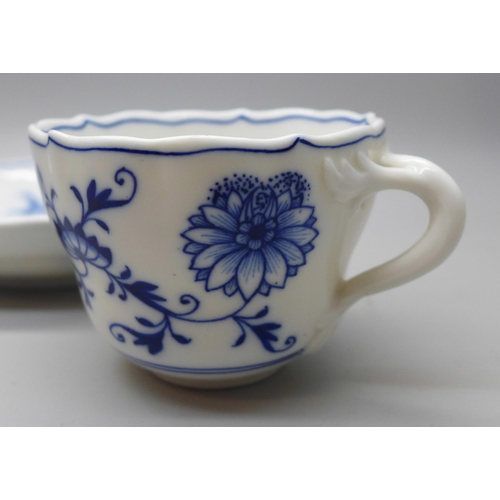 615 - A Meissen small blue and white Blue Onion pattern cup and saucer with crossed swords mark to base