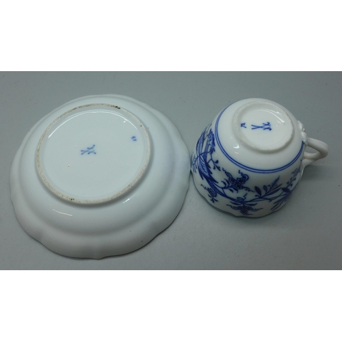 615 - A Meissen small blue and white Blue Onion pattern cup and saucer with crossed swords mark to base