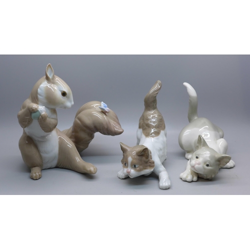 618 - A Lladro squirrel, two Lladro cats and a Royal Crown Derby 2451 coffee can and saucer, star crack on... 