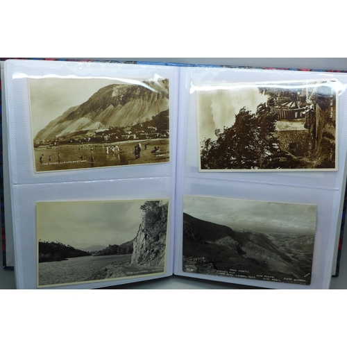 626 - Postcards; a postcard album containing 120 black and white photographic cards