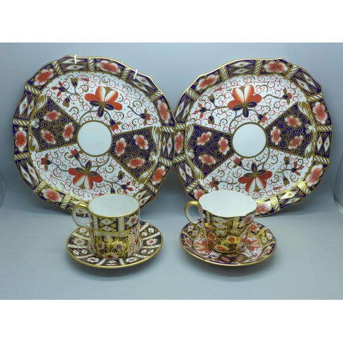 631 - A pair of Royal Crown Derby 2451 pattern plates, cup and saucer and an Imari coffee can and saucer, ... 