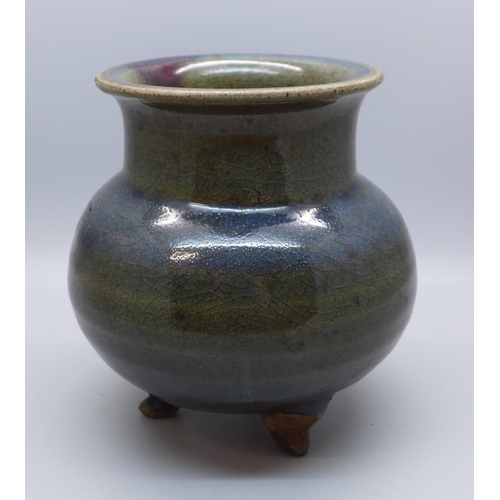 637 - A studio pottery three footed glazed pot