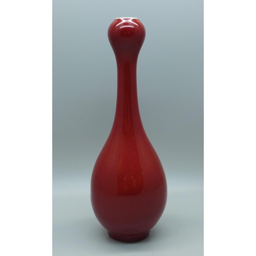 638 - A Chinese red glazed vase, 17cm