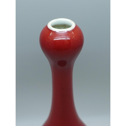 638 - A Chinese red glazed vase, 17cm