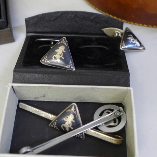 653 - A leather collar box, sets of cufflinks etc., including a sterling silver Siam cufflink and tie bar ... 