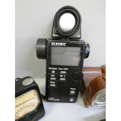 659 - Light meters including Bakelite Weston, Flanimex Sekonic, and a Minolta-16 camera