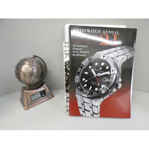 667 - A novelty Global clock and four books on wristwatches