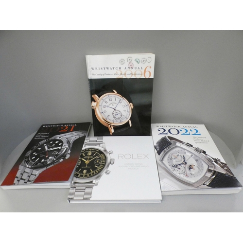 667 - A novelty Global clock and four books on wristwatches