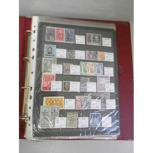 668 - Two albums of stamps and a collection of twenty-two stamp books/book of stamps including Football He... 