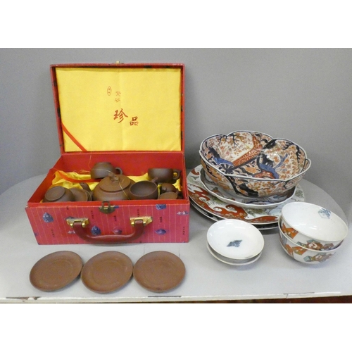 702 - A Chinese terracotta tea service, boxed, a Japanese Imari bowl, a Satsuma dish and rice bowls and co... 