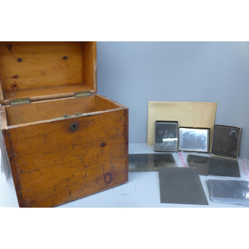 732 - A wooden box of sixty Victorian era glass plate negatives