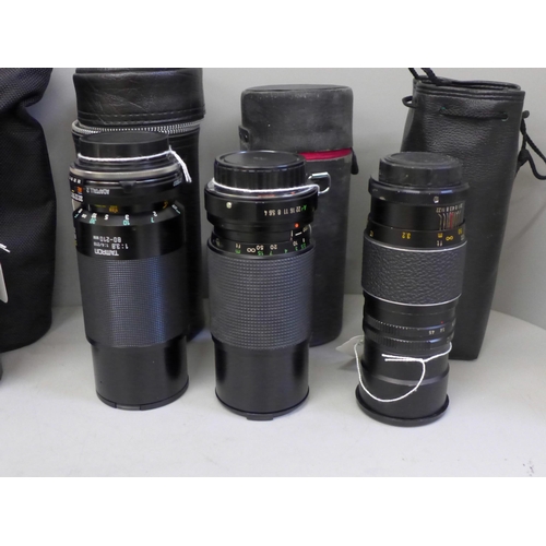 737 - An aluminium camera case and seven lenses