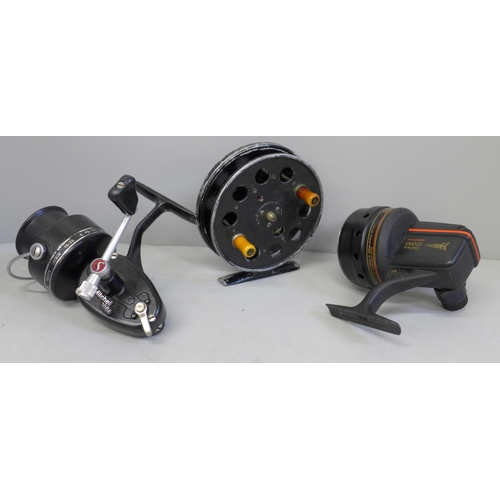 754 - Three fishing reels, a 1940s/50s Speedia Centre-Pin, a French Mitchell 300A and Daiwa Harrier 120m G... 