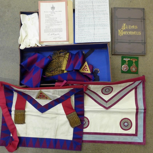 764 - A Masonic case and contents including two medallions