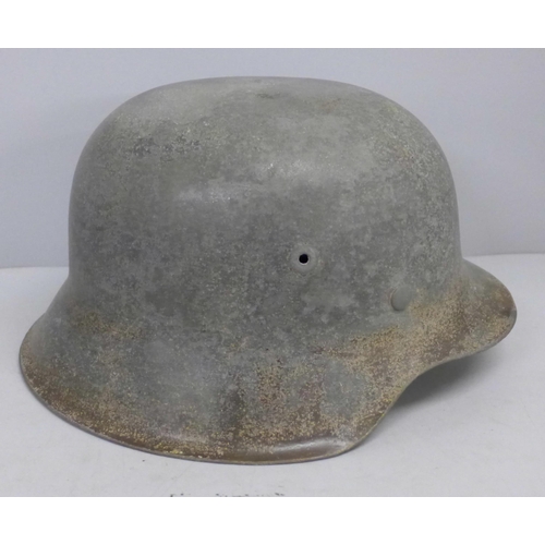 769 - A German M42 helmet with inner leather replaced