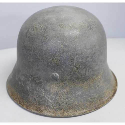 769 - A German M42 helmet with inner leather replaced