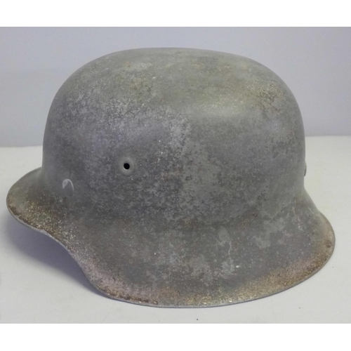 769 - A German M42 helmet with inner leather replaced