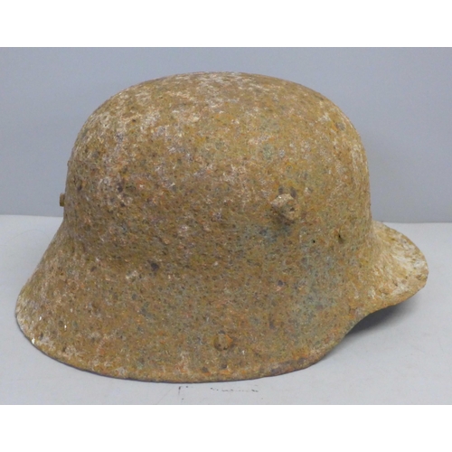 770 - A WWI battle damaged German helmet