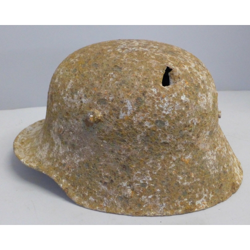 770 - A WWI battle damaged German helmet