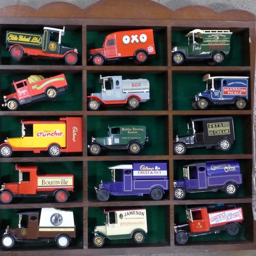 781 - Two display cases containing thirty die-cast model advertising vans