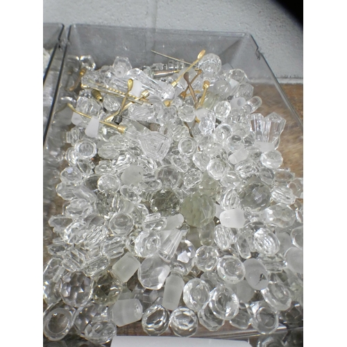 815 - Two large boxes of over 530 cut glass and moulded glass stoppers, to fit scent and perfume bottles, ... 