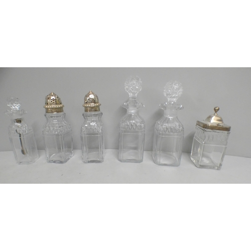 816 - A six bottle old Sheffield plate cruet with original cut glass bottles, silver pepper tops and silve... 