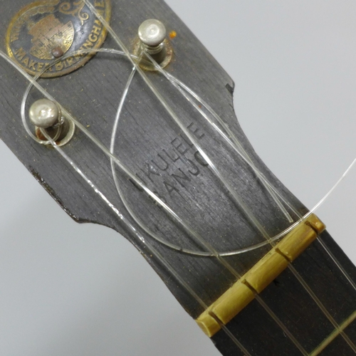 825 - A banjo, cased