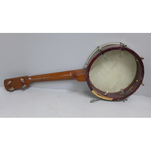 825 - A banjo, cased