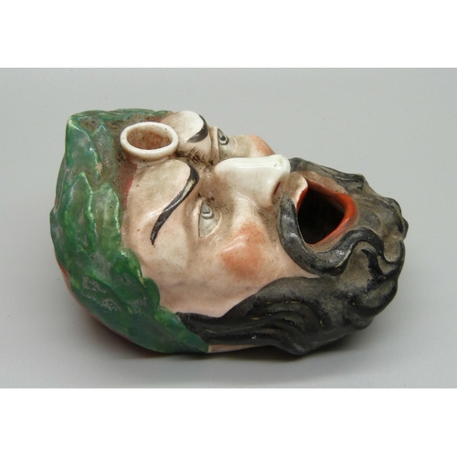 831 - A 19th Century continental mask inkwell and pen stand