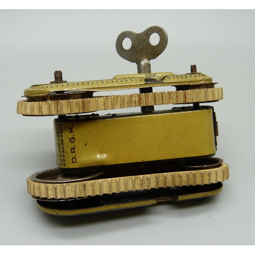 832 - A D.R.G.M. German tin-plate clockwork toy tank, marked Gama, with key, 72mm long