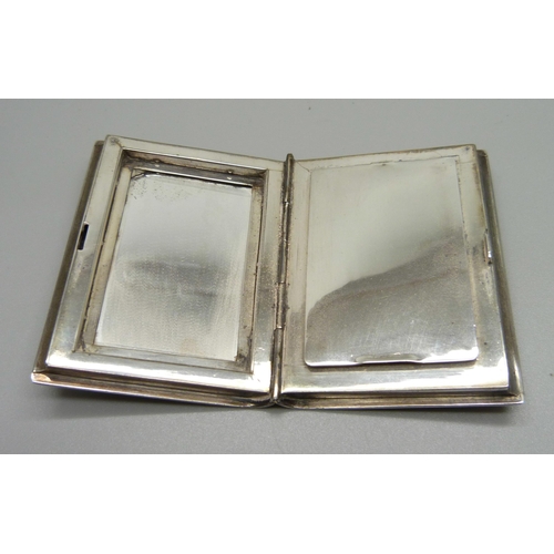 868 - A sterling silver compact in the form of a book, with initials, 51mm x 68mm