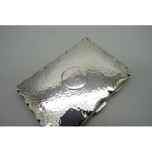 869 - A hammered silver card case, Birmingham 1904, with initials, 70mm x 101mm