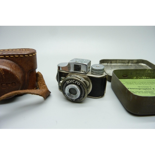 873 - A Mycro Spy camera, Sanwa Co., made in Japan, and a Wynne's Infallible Exposure Meter, with tin and ... 