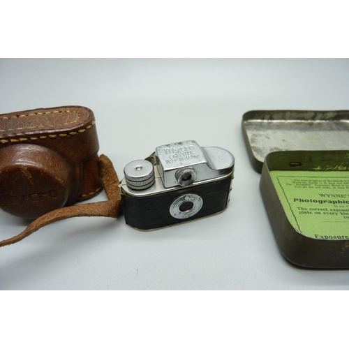 873 - A Mycro Spy camera, Sanwa Co., made in Japan, and a Wynne's Infallible Exposure Meter, with tin and ... 