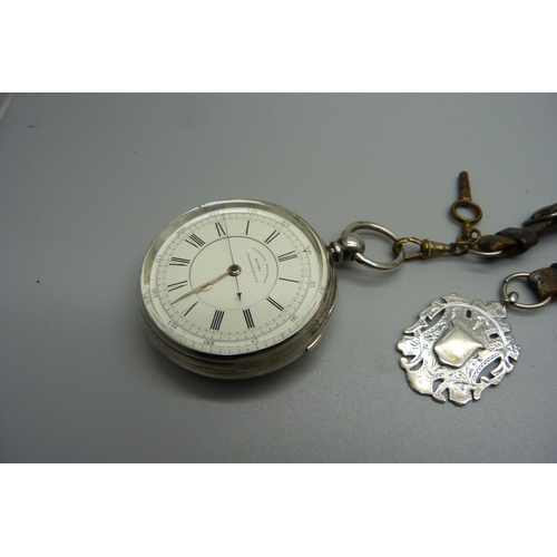 875 - A silver cased centre seconds chronograph pocket watch, Isaac Falk, Manchester, Chester 1888, with a... 