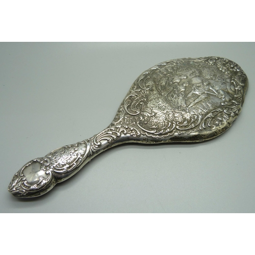 876 - A silver backed hand mirror, Birmingham 1909