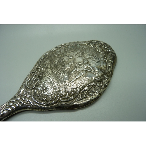 876 - A silver backed hand mirror, Birmingham 1909