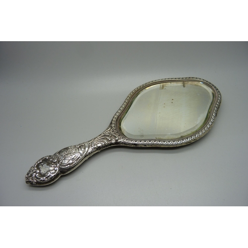 876 - A silver backed hand mirror, Birmingham 1909