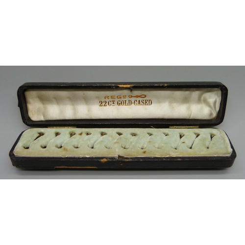 879 - A vintage twelve ring dealers box, (lacking fastener)