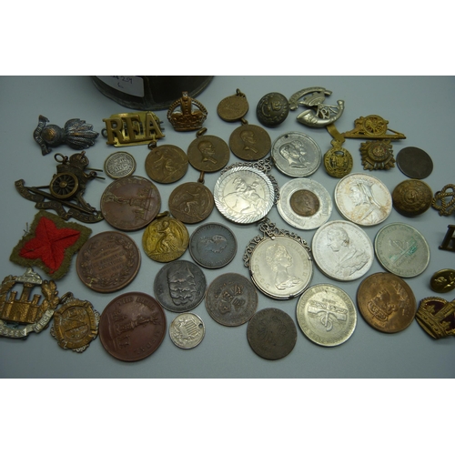 885 - A collection of medallions, coins, badges, buttons, etc.