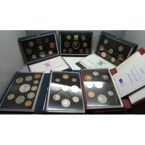 899 - Seven Royal Mint GB proof coin sets