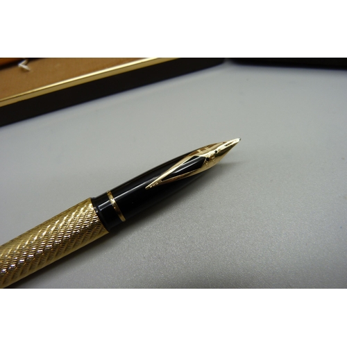 904 - A Sheaffer gold plated pen set, ink pen with 14ct gold nib and a Cross ballpoint pen, both cased