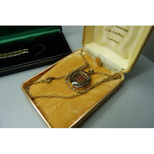 908 - Two lady's wristwatches, Rotary and Seiko, boxed, and an enamelled 3d bit on a chain