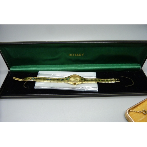 908 - Two lady's wristwatches, Rotary and Seiko, boxed, and an enamelled 3d bit on a chain