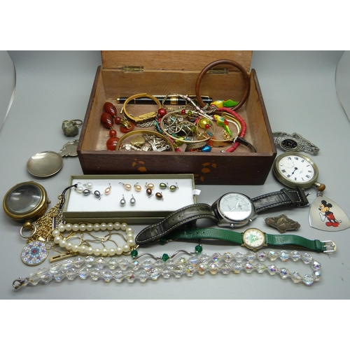 924 - A box of costume jewellery, wristwatches, brass watch case and vesta