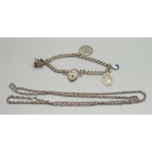 928 - A silver charm bracelet, 11g, and a chain